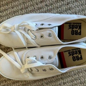 Brand new Keds white sneakers. Never worn.